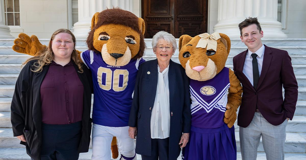 Governor Kay Ivey poses with mascots Leo and Una as well as SGA President Amber Sandvig at the capitol in Montgomery.